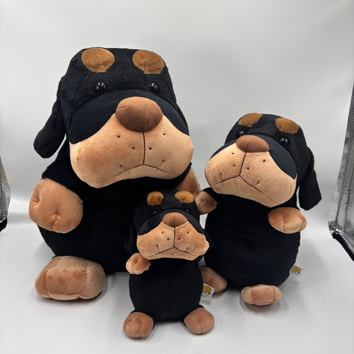 Black and tan dog plush family samples